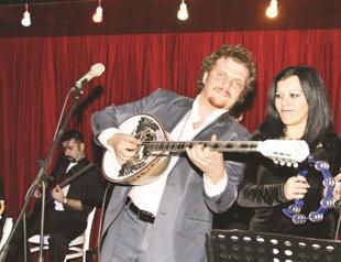 Buzuki Orhan on stage with brass band