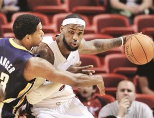 LeBron carries load as Miami shines on