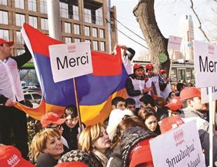 Turkey defies French vote, eyes court action