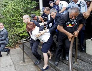 Australia police rescue PM from race protests