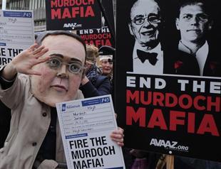 Ex-policeman arrested in UK phone hacking probe