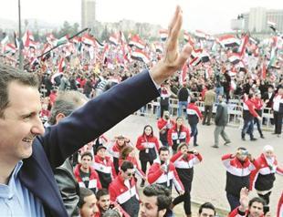 Assad takes defiant message to street
