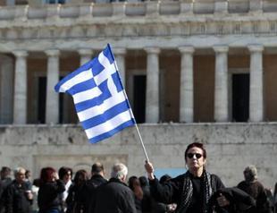 Riot police guard Greek assembly as protesters gather