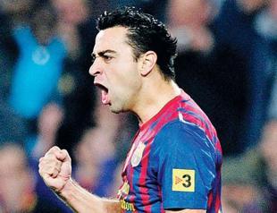 Xavi enjoys milestone as Barça downs Betis