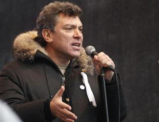 Putin critic plays down Misha for president badge