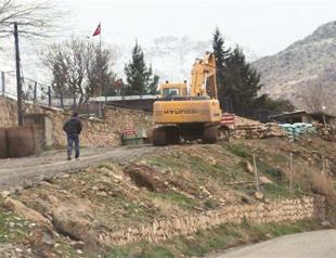 Bones unearthed in suspected mass grave