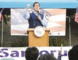 Santorum stuns Romney with hat-trick triumph