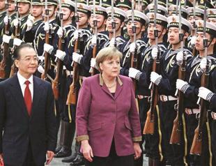 Merkel pushes China on Iran