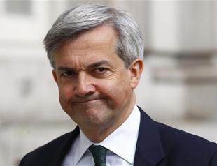 UK minister Chris Huhne resigns, to face criminal charges