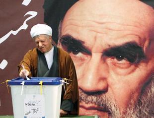 Iranians vote to pick between conservatives