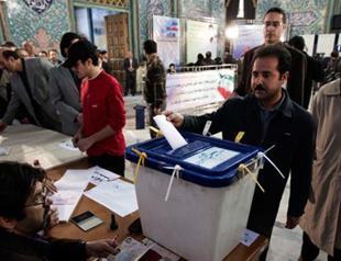 Iran touts high turnout, Ahmadinejad faction losing