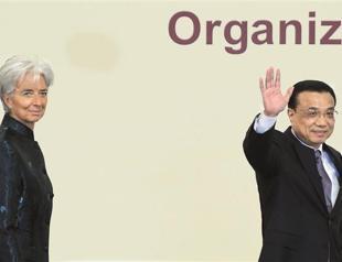 Global economy on recovery path, risks remain, IMF says