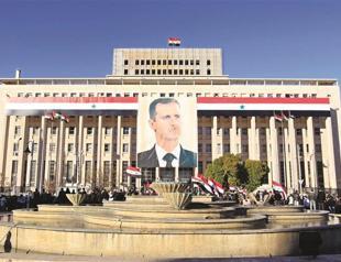Syria central bank head says will defend currency
