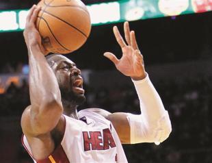 Wade scores 30 to lead Heat to win over Kings