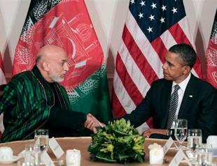 Obama welcomes Karzai call for calm after shooting