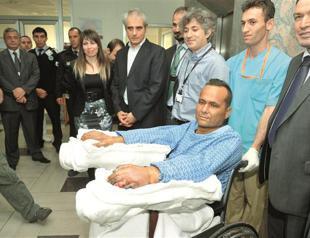 Patient meets the press after receiving 2 arms