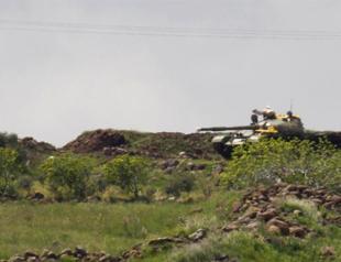 Syrian forces clash with rebels near Turkish border: activists