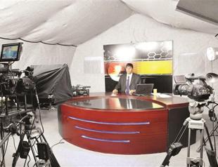 Local TV broadcasting in a tent in quake-hit town