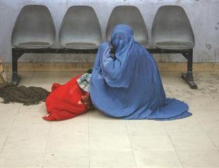 Karzai hit hard on women’s bill