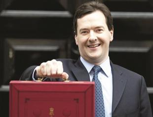 Britain cuts income tax in political austerity rejig