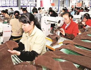 China raises quota for foreign shares