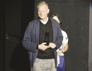 Award to director at theater fest