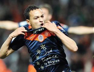 Montpellier wins with late goal to keep lead