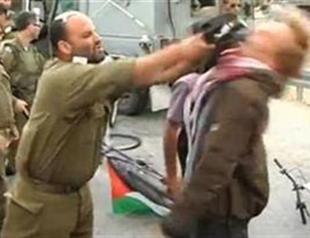 Israel officer reassigned after attack on activist