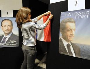 Sarkozy closes on Hollande as France elects president