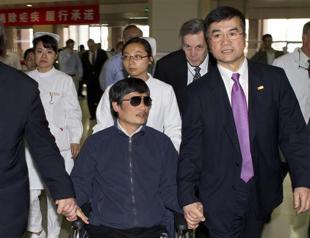 China activist seeks official help to go to US