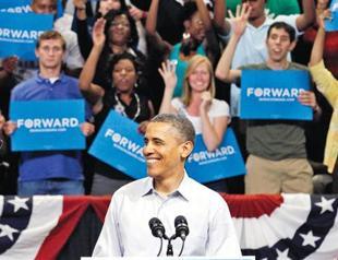 Obama dives into poll campaign, hits Romney
