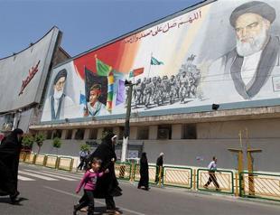 Iran seeks end to sanctions at talks, hits out at France