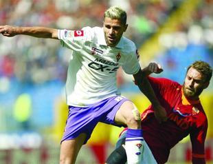 Rossi sacked after hitting own player