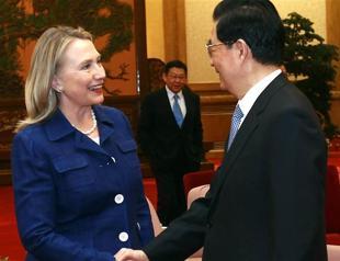 Clinton, in China, calls human rights essential