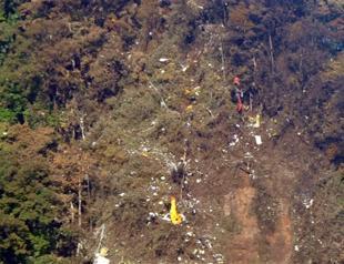 Indonesian rescuers find 12 bodies at jet crash site