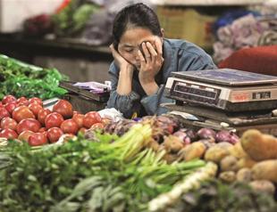 China’s inflation eases, as economy slows further