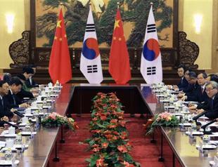 China, Japan, South Korea warn North Korea off atom test