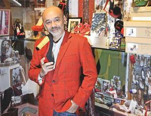 Designer defends his right to red shoe soles