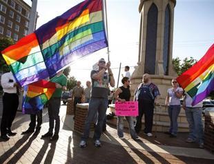Gays cheer, critics condemn Obama on same-sex marriage