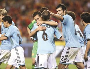 Spain seeks to cap historic treble