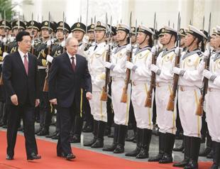 Putin in China to cement ties