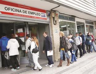 Downgrade hits Spain in crisis