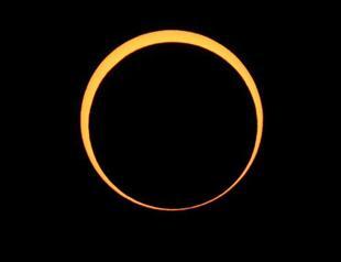 Millions look skyward as eclipse crosses Asia, US