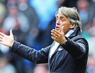 Mancini cautious as City closer to victory