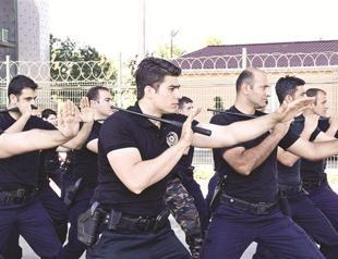 Police show off batons as beating video appears