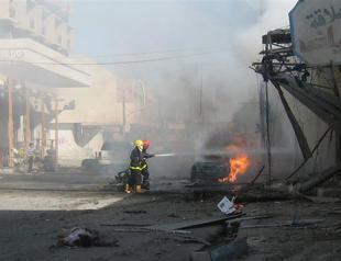 Baghdad market bombs kill 14, wound more than 100