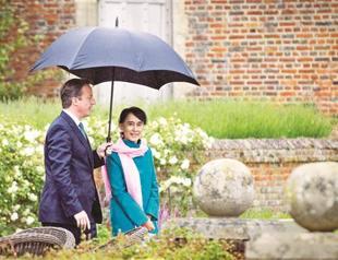 Suu Kyi returns home after Euro tour