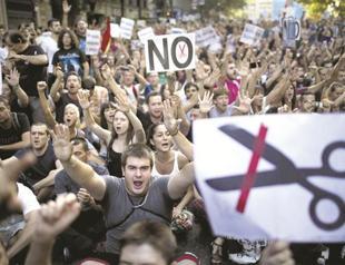 Spain sees 56 bln euro savings in new austerity measures plan