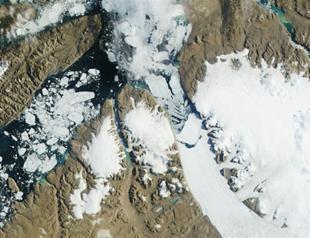 Massive iceberg breaks off Greenland glacier