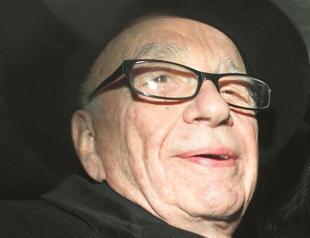 Murdoch quits boards of British newspapers